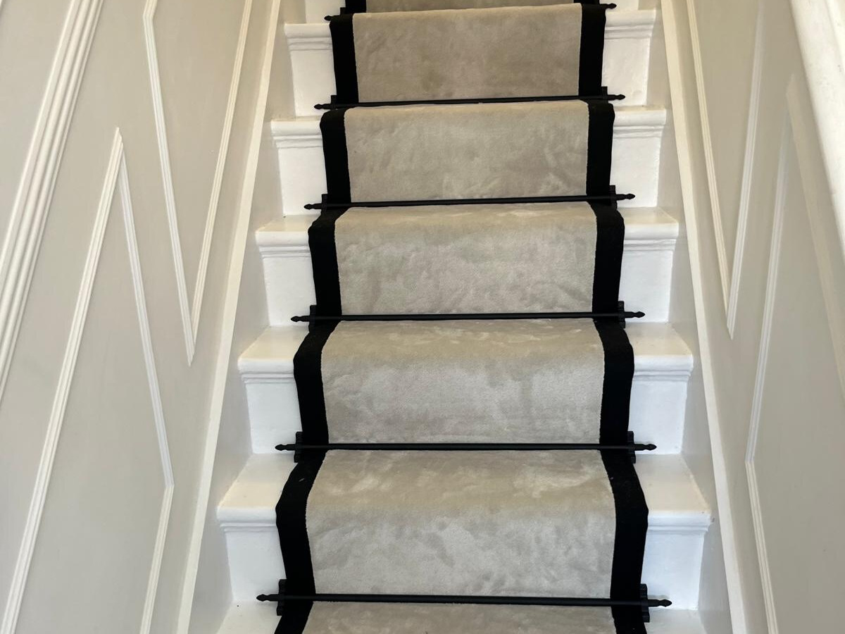Artisan Seta Milan stair runner with black linen edging and Jubilee Black rods fitted in Edmonton N18 by Carpet World London